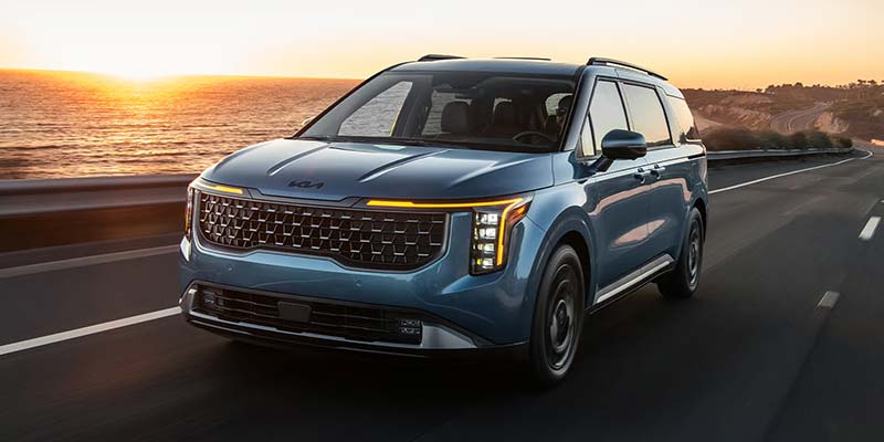 2026 Kia Carnival Driving Along Coast