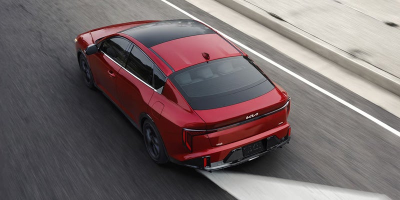 2026 Kia K4 sedan driving on the highway